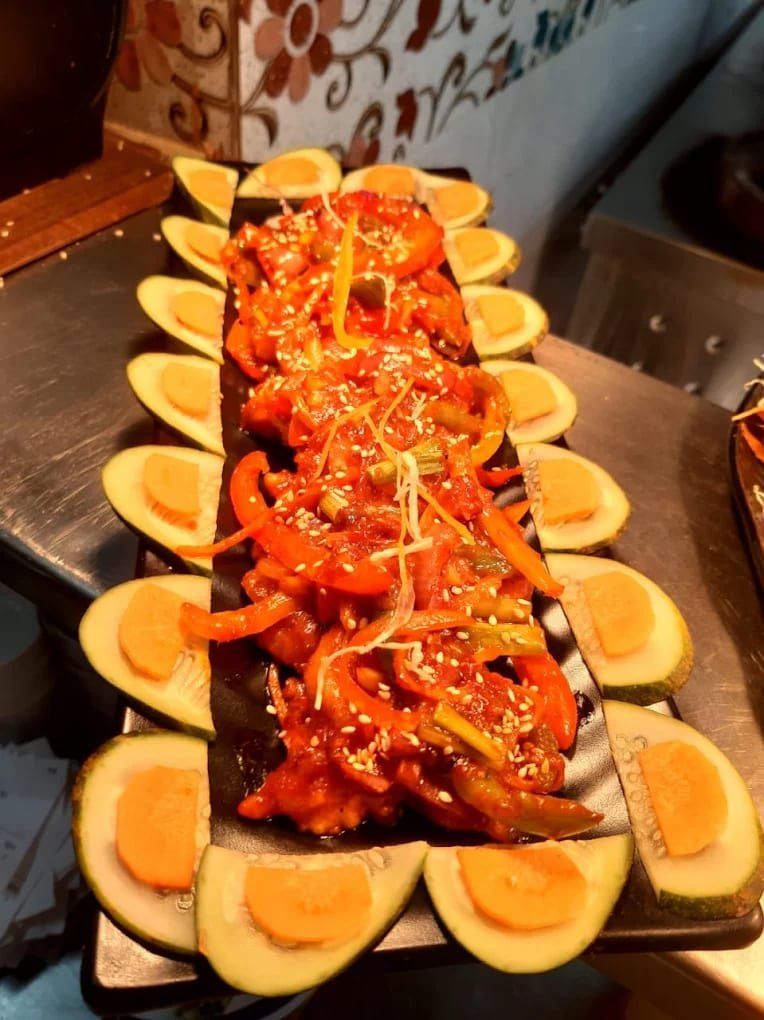 Chinese platter plated with cucumber and carrot