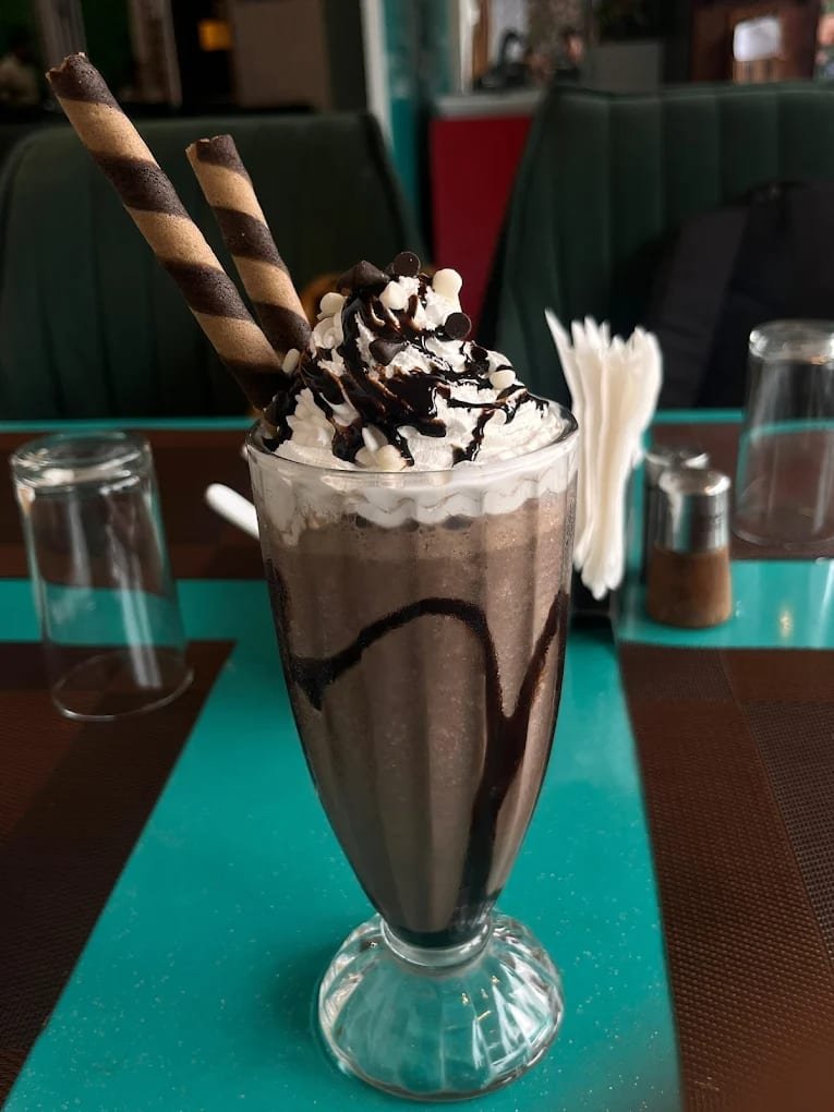 Tall mocha shake with chocolate wafer rolls