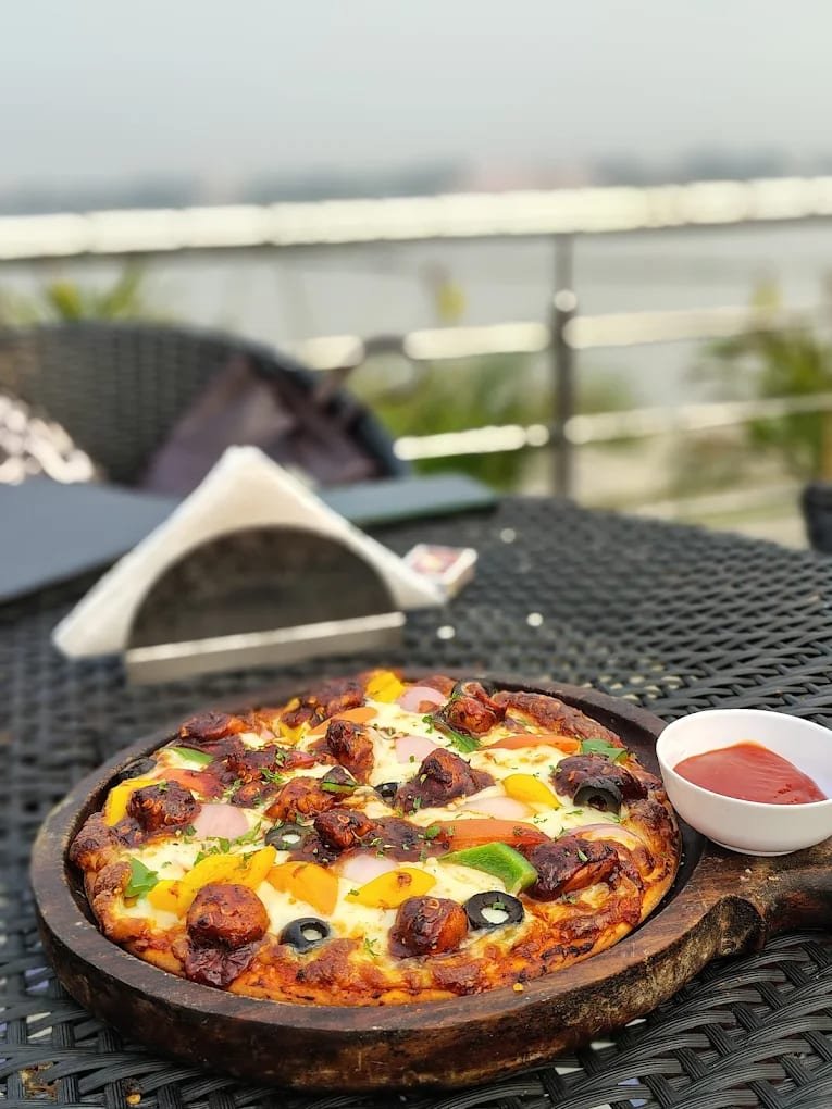 Pizza with river backdrop