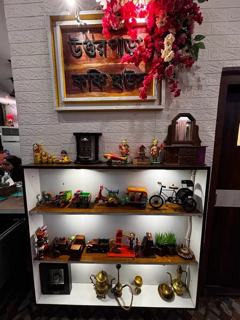 Shelf of Bengali toys and brassware